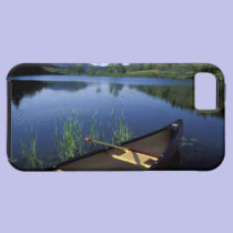 A canoe rests on the shore of Little Long Pond casemate cases