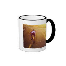 A cyclist on road bike near Great Salt Lake Coffee Mugs