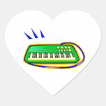 A green keytar with a blue strap graphic, stickers