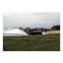 A landing craft air cushion comes ashore