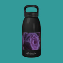 A lavender rose, on a waterbottle water bottles