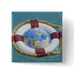 A life preserver and world globe floating on buttons