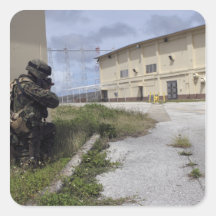 A Marine posts security Stickers