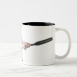 a pretty young caucasian woman is wearing a mug