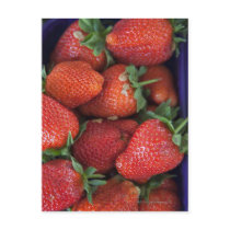a punnet of ripe fresh strawberries for sale in post card