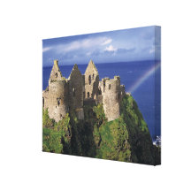 A rainbow strikes medieval Dunluce Castle on Canvas Print