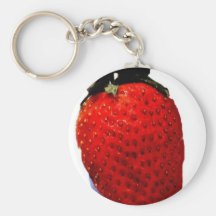 A red ripe strawberry, ready to be eaten, yummy key chains