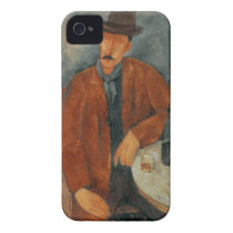 A seated man leaning on a table casemate cases
