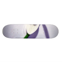 A Single Snowdrop On The Table Skateboards