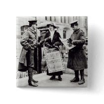 A Suffragette selling newspapers to two buttons