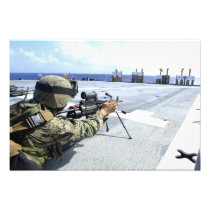 A US Marine adjusting his weapon