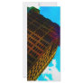 A vibrant and tall building against the  blue sky rack card design