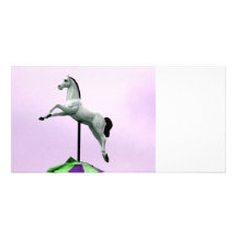 A white horse carousel statue against purple personalized photo card