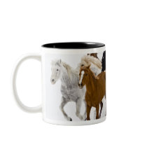 A winter scenic of running horses on The Coffee Mug