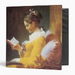 A Young Girl Reading Binder