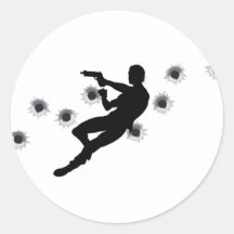 Action hero in gun fight silhouette sticker