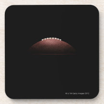 American football ball on black background drink coaster