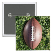 American football on grass pin