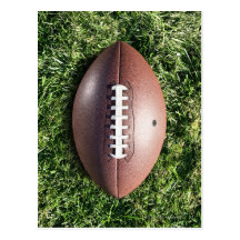 American football on grass post card