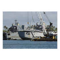 An F-15 Eagle gets a lift from a barge crane