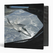 An F-22 Raptor banks away from a KC-135 Binders