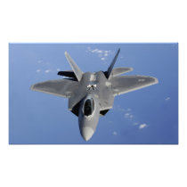 An F-22 Raptor moves into position to receive f