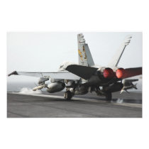 An F/A-18C Hornet launches from the flight deck