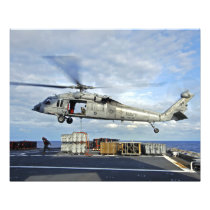 An MH-60S Seahawk prepares to deliver ammunitio