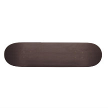 Attractive tiny black leafy plant on retro purple skateboard deck
