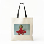 Baby girl doll dressed in red bag