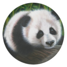 Baby panda balancing on a log dinner plate