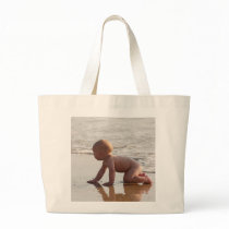 Baby playing in the sand on the beach bags