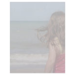 Back view of young girl at a Florida beach letterhead