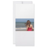 Back view of young girl at a Florida beach rack cards