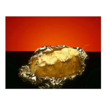 Baked potato with sour cream, against orange backg postcard