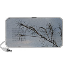 Bare tree branches against a cloudy sky notebook speaker