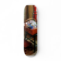 Basket of Cloth and Yarn on Chair Skate Boards