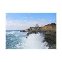 Beach wave crashing into the coast stretched canvas prints