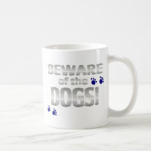 Beware of the dogs! with blue paw prints coffee mug