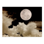 Big moon passing behind clouds postcards