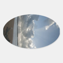 Big rays through clouds oval sticker