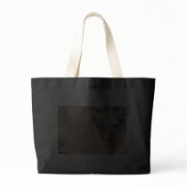 Bird perched on a branch of a blossoming tree tote bags