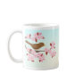 Bird sitting in a cherry blossom tree mug