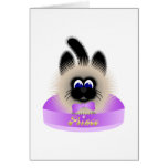 Black And Brown Cat With Pale Purple Tie In A Bed