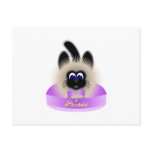 Black And Brown Cat With Pale Purple Tie In A Bed