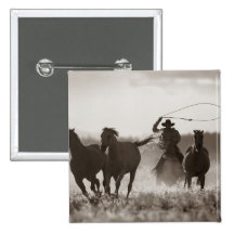 Black and White photo of a Cowboy Lassoing Horses Pin