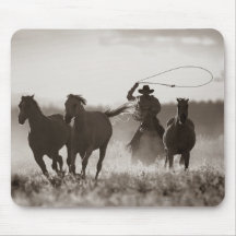 Black and White photo of a Cowboy Lassoing Horses Mouse Pad