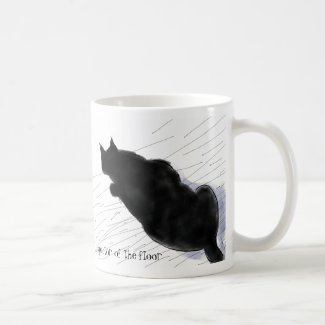 Black cat inspects the floor mugs