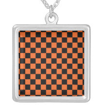 Black checkers on orange background necklaces