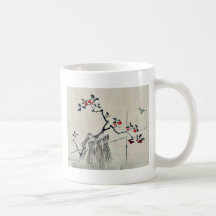 Blue bird on a branch of a fruit tree coffee mugs